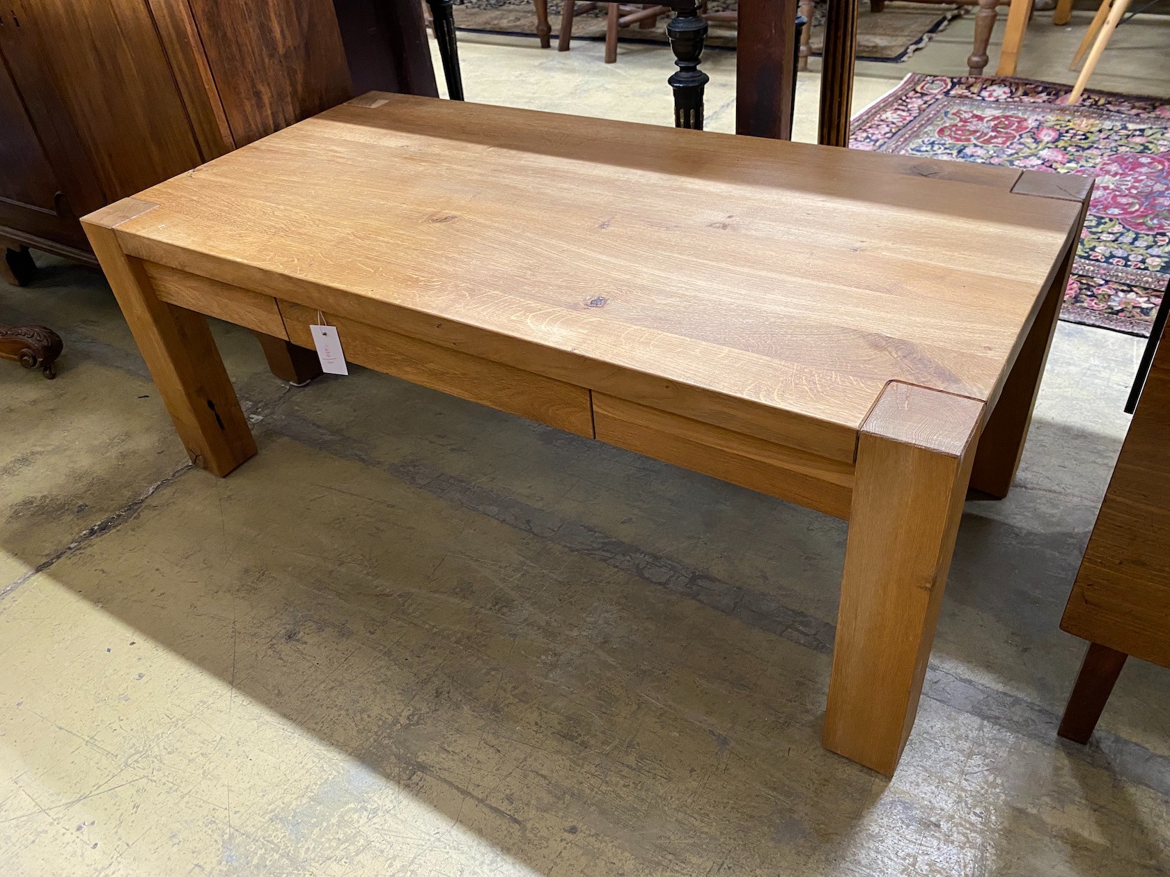 A contemporary rectangular oak coffee table, fitted drawer, width 120cm, depth 60cm, height 46cm